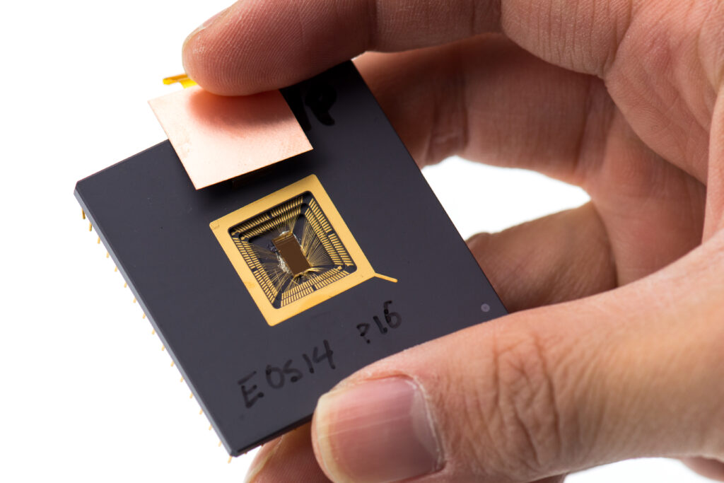 Yunsup Lee holding RISC V prototype chip